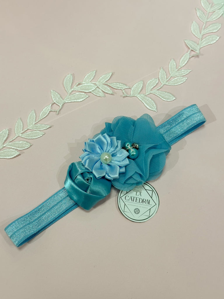 Liga de novia celeste con flores