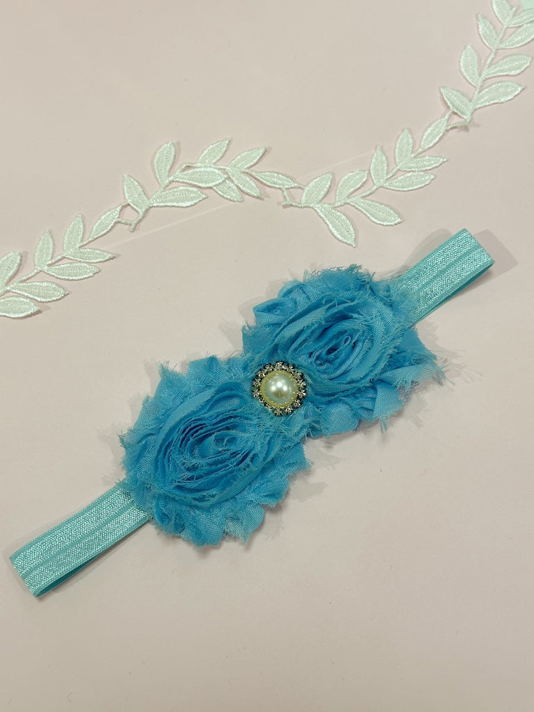 Liga de novia celeste con flores
