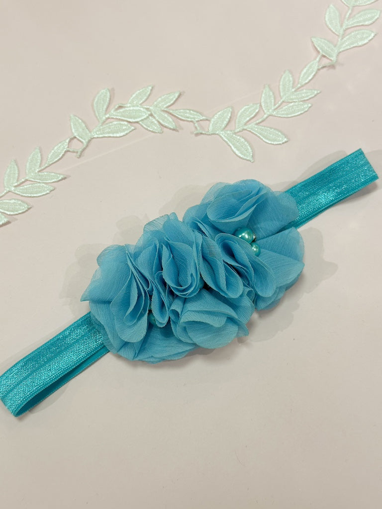 Liga de novia celeste con flores